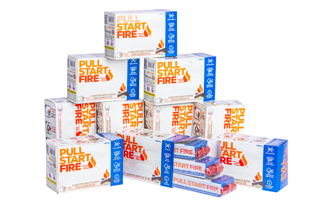 Multiple Pull Start Fire fire starter boxes stacked in a product display with open packaging showing red pull string bricks